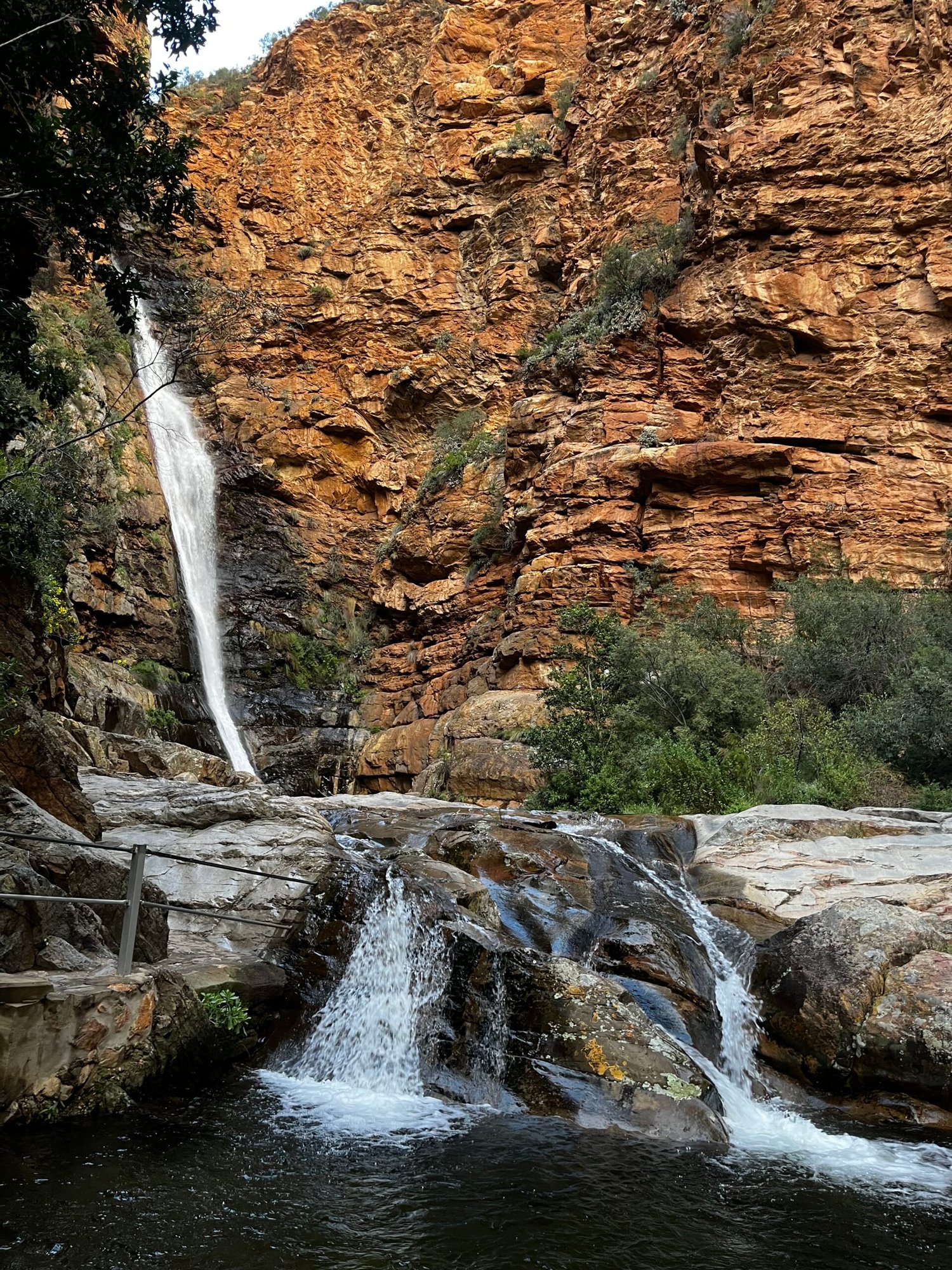 Meiringspoort Waterfall, part of the Meiringspoort Pass. Red rocks and a fall.