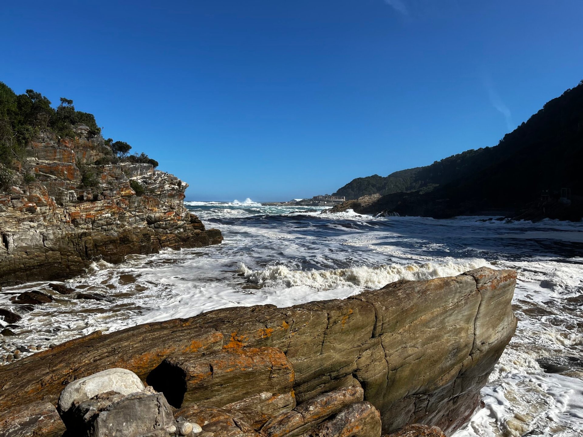 Rock with high waves in Tsitsikamma National Park, Storms River Mouth. One of our best hikes on the Garden Route