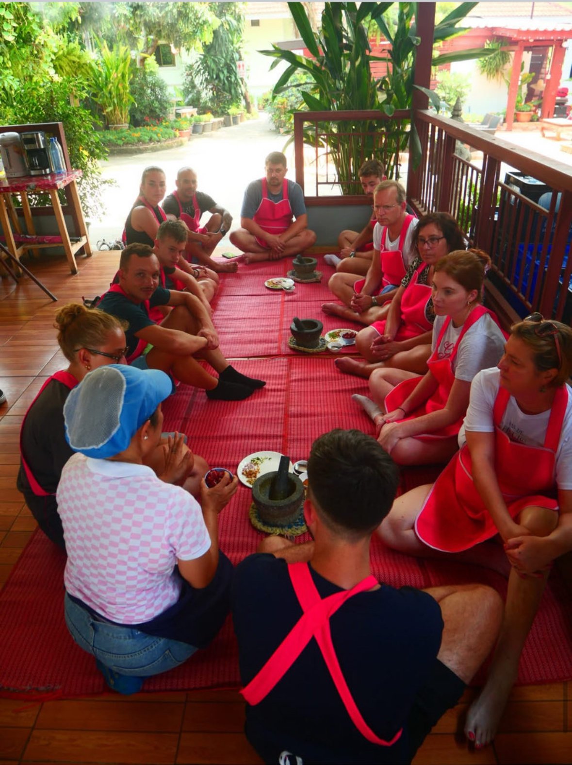 Group listening to instructions in Chiang Mai cooking class