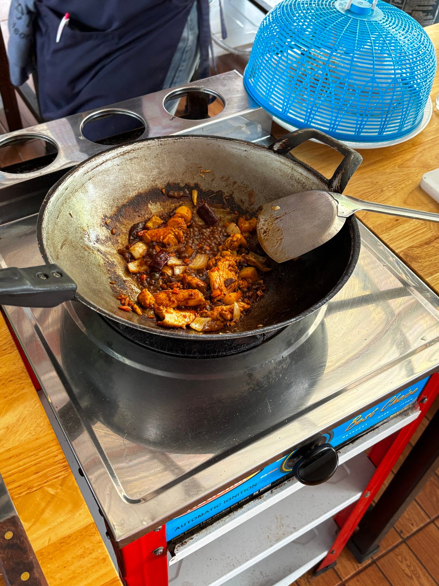 Wok with stir-fry in Thai cooking class