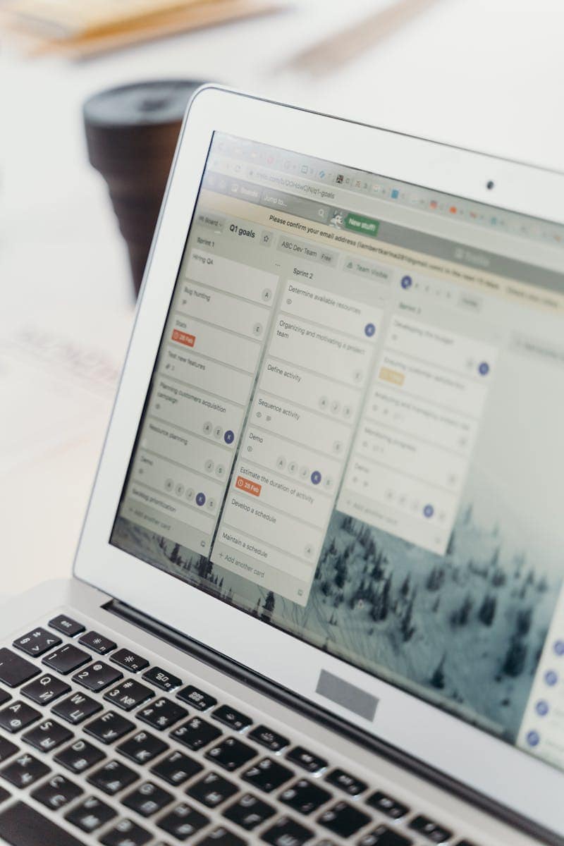 Fluent Boards, Project Management, WordPress, Fluent CRM, Kanban, Planning, Workflow, Close-up of a laptop screen showing project management software interface. Perfect for business or tech themes.