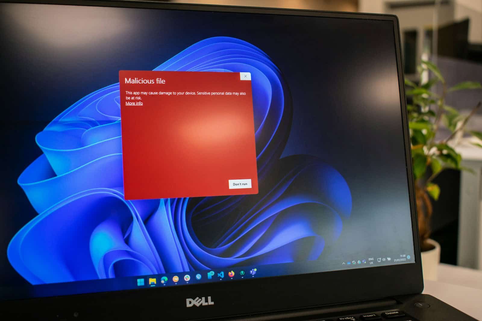 Malware Detection, a dell laptop computer with a red screen