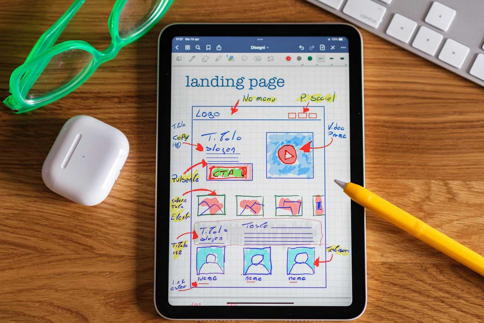 Maximizing Conversions: A Guide to Mastering the Marketing Funnel, Close-up of tablet showing a hand-drawn landing page design, ideal for web development concepts.