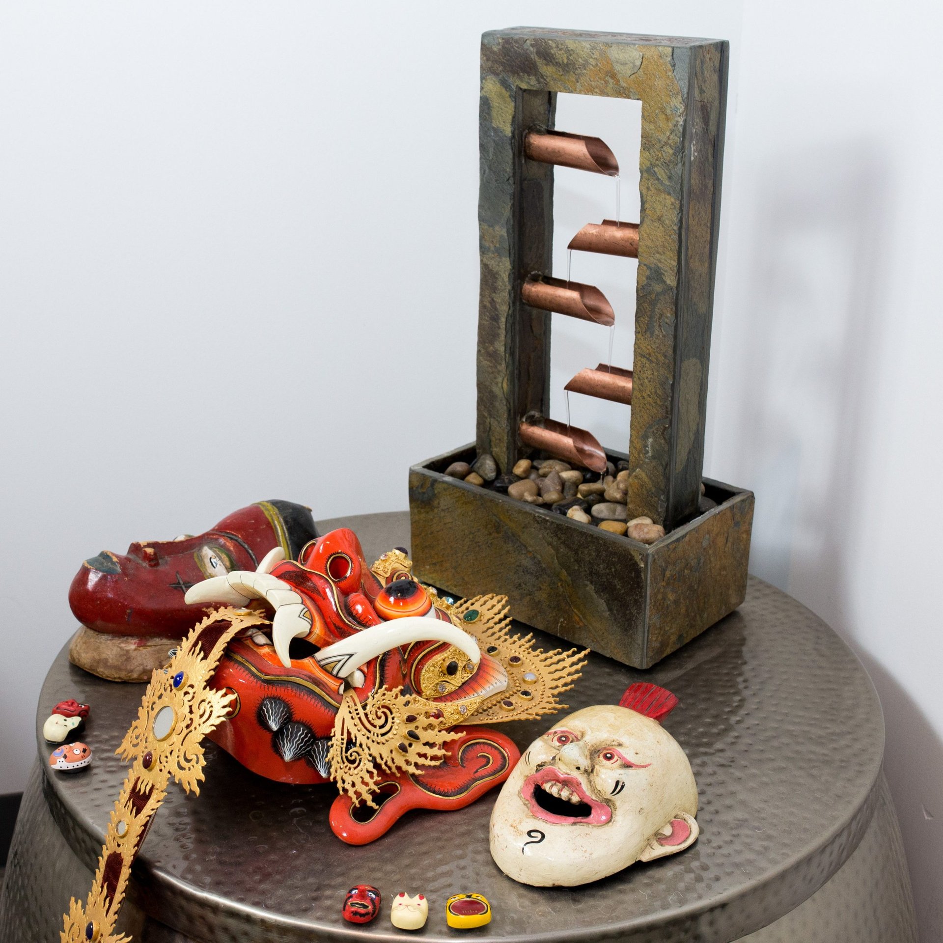 Water features and masks can be found throughout the studio