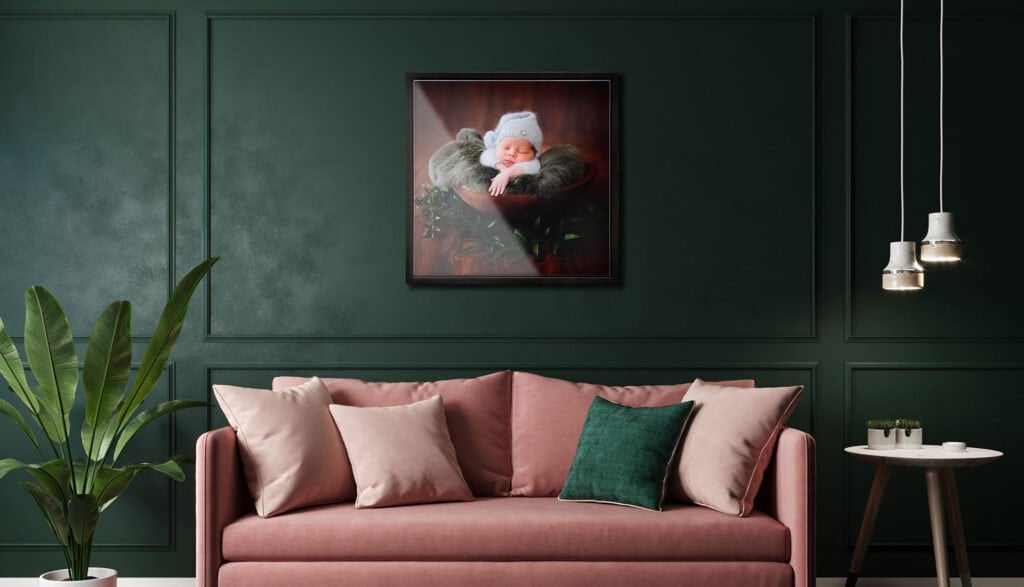 Seattle Tray Frame 5 Family Photographer A framed picture of a baby in a bowl on a green wall.