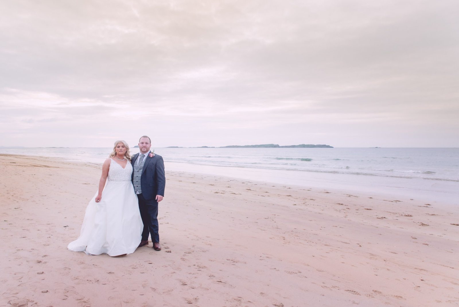 Armoy wedding of Louise & Sam Wilson 1 Northern ireland wedding portrait on portrush beach