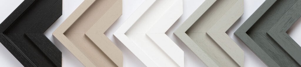 The New Hockney Frame 1 Family Photographer A range of picture frame corner samples in various colors and textures displayed in a row, showcasing options for custom framing.