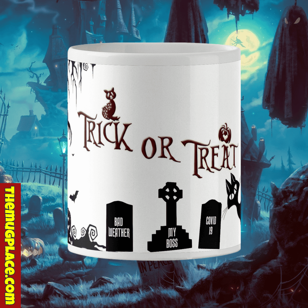 A Hallowe'en Mug featuring "Trick or Treat" and gravestones for Bad Weather, My Boss, and Covid 19 in a spooky graveyard scene.