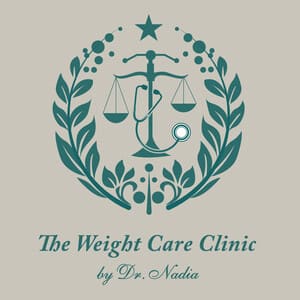 Logo for The Weight Care Clinic by Dr. Nadia, featuring a scale balanced on a stethoscope, encircled by laurel branches and a star above.
