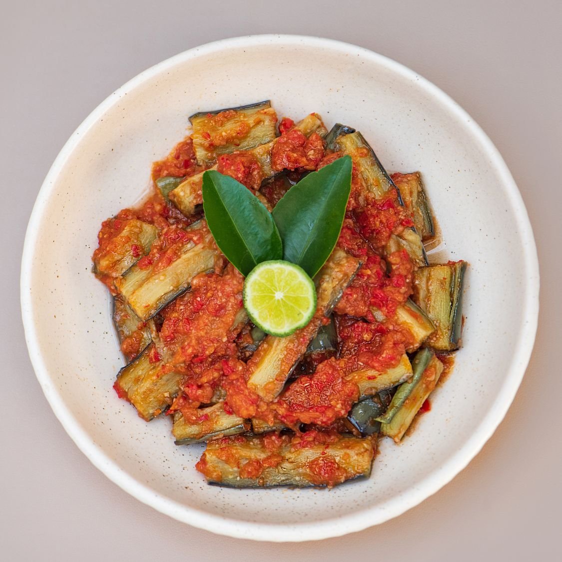 Braised eggplant with tomato sauce at THIS IS BALI Indonesian restaurant Ubud, flavorful vegetarian Indonesian food dish