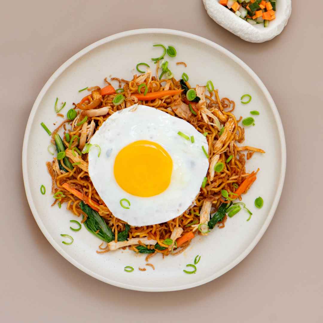 Traditional Mie Goreng Indonesian fried noodles at THIS IS BALI restaurant Ubud with vegetables and authentic Balinese spices