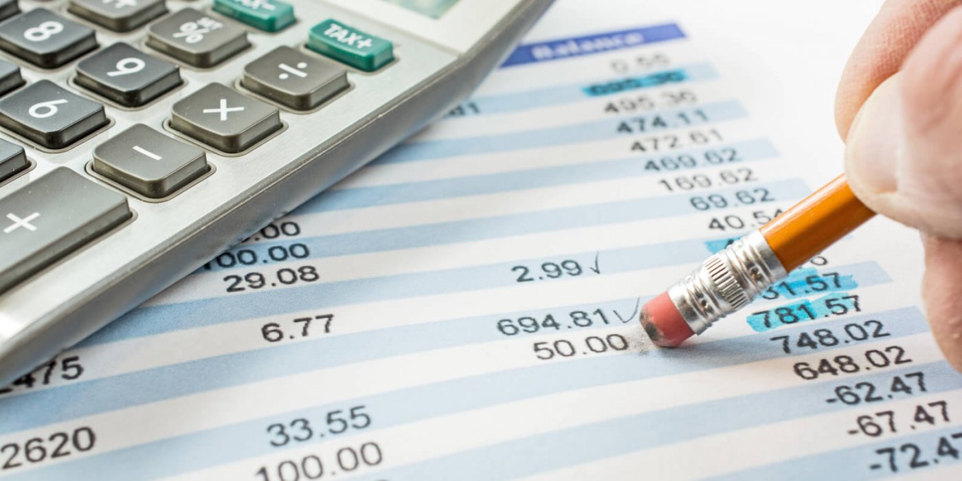 Balancing a bank statement close-up with pencil and calculator img-11