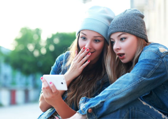 women are watching videos on the mobile