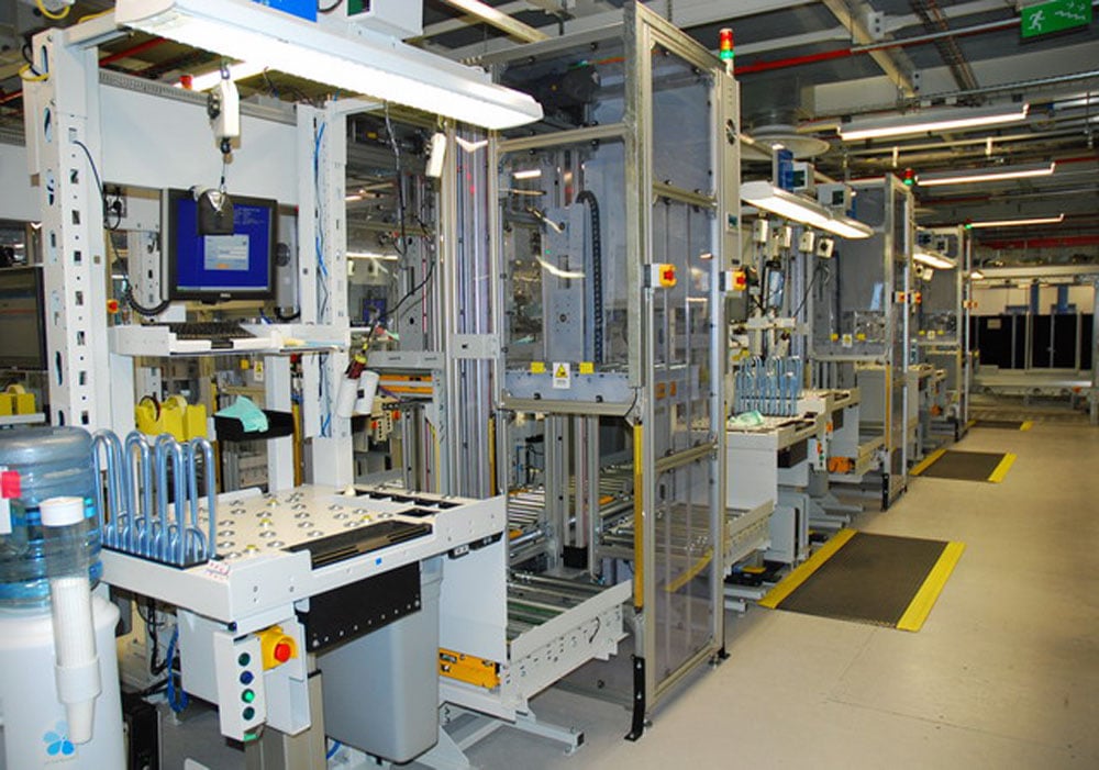 Customised work station with integrated conveyors and lifts Customised work station with integrated conveyors and lifts