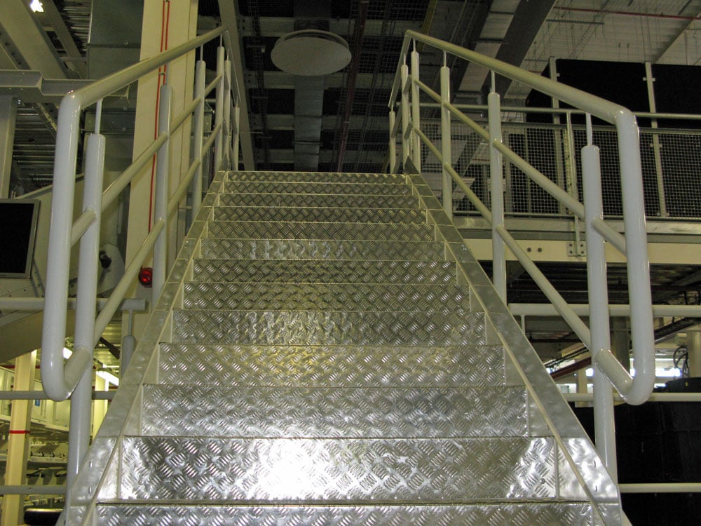 Stainless steel stairs with powder coated protection barrier