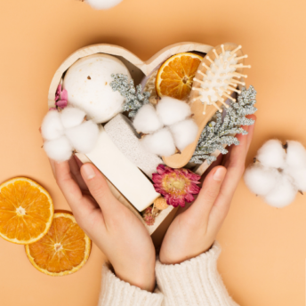 AN IMAGE OF A HEART SHAPED BASKET FILLED WITH SELF CARE PRODUCTS {{brizy_dc_image_alt imageSrc=