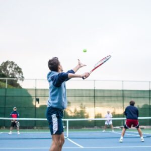 Tennis Player Hitting a Serve Tennis Player Hitting a Serve